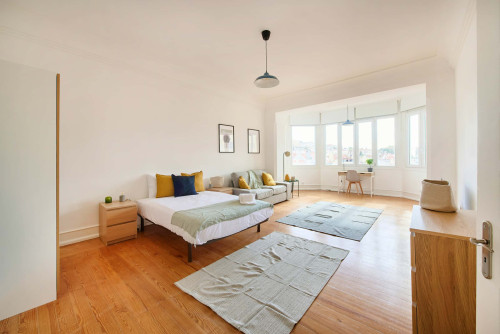 Bedroom in a 7-bedroom apartment in R. Alexandre Herculano, Lisbon - Room 6