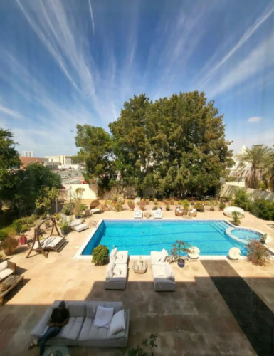Elegant 19,000 Sq. Ft. Retreat: Luxurious Living with Private Garden, Pool, and Dual Kitchens