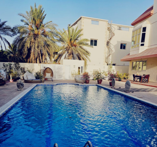 Elegant 19,000 Sq. Ft. Retreat: Luxurious Living with Private Garden, Pool, and Dual Kitchens