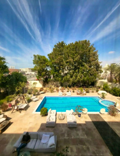 Elegant 19,000 Sq. Ft. Retreat: Luxurious Living with Private Garden, Pool, and Dual Kitchens