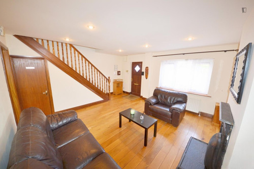 Bed in a cosy twin female bedroom