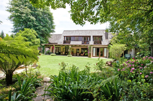 A breezy villa residence with luscious gardens and sunny open space