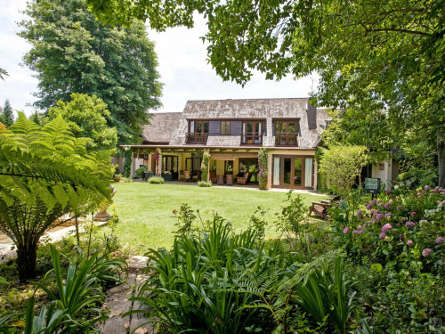 A breezy villa residence with luscious gardens and sunny open space