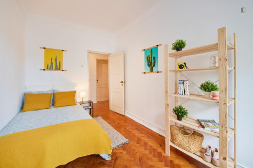 Sunny bedroom in a 8-bedroom flat