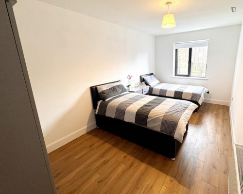 Bed in a bright twin female bedroom, in Mallow Road
