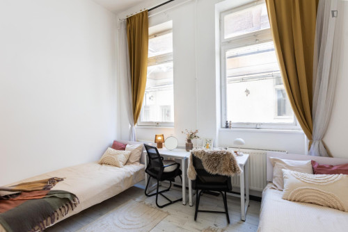 Bed in neat twin bedroom near Budapest-Keleti station