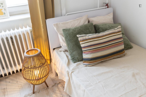 Bed in an inviting twin bedroom, in District VII