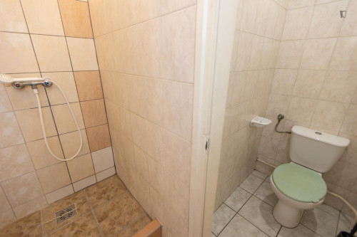 Bed in neat twin bedroom in the centre of Budapest