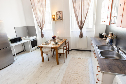 Bed in neat twin bedroom near the centre of Budapest