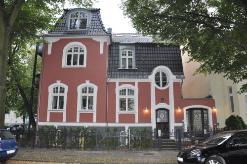 furnished designer attic - in a renovated old building with balcony - near the Havel river