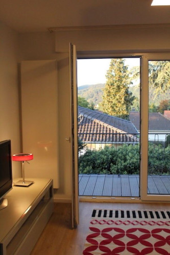 3 rooms with designer furniture and art, with chimney, great balcony, popular location