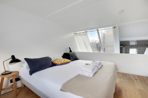 Newly refurbished, cosy and atypical flat, quiet and bright with a beautiful French window over the entire height of the room