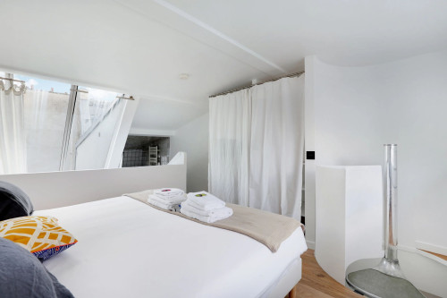 Newly refurbished, cosy and atypical flat, quiet and bright with a beautiful French window over the entire height of the room