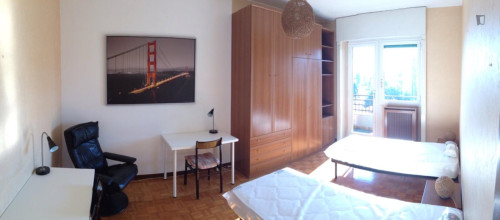 Bed in a shared bedroom in Milan