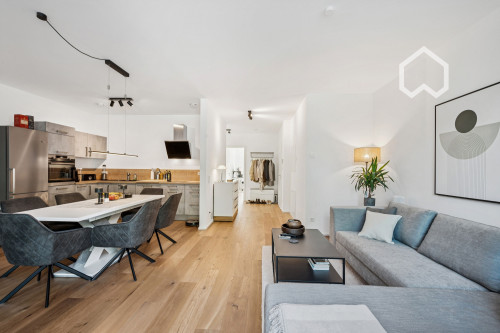 Furnished, newly built apartment w. heated floors, parking garage and modern amenities