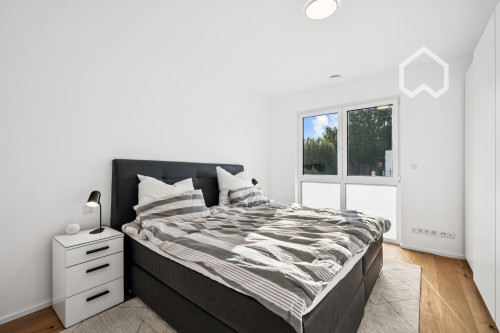 Furnished, newly built apartment w. heated floors, parking garage and modern amenities