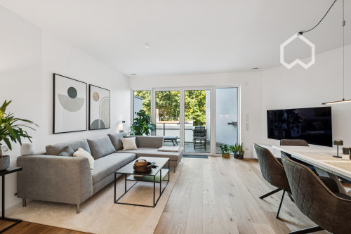 Furnished, newly built apartment w. heated floors, parking garage and modern amenities