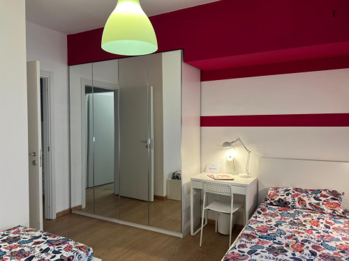 Bed in a bright twin bedroom in Garibaldi Repubblica