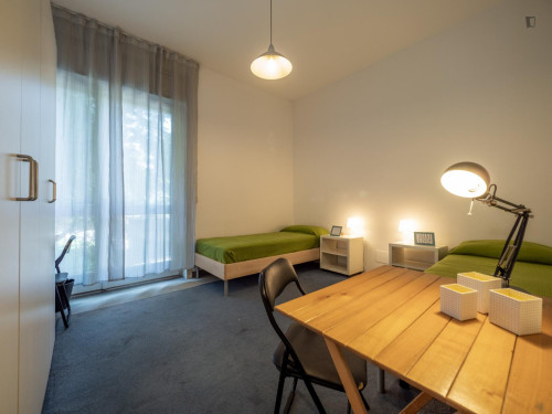 Bed in neat twin bedroom near Bocconi University