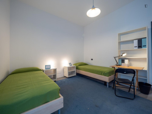 Bed in neat twin bedroom near Bocconi University