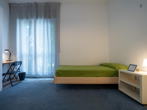 Bed in neat twin bedroom near Bocconi University
