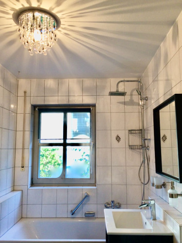 Fully Furnished: Large 2-room apartment, sunny terrace, near the main train station, underground parking space, Wi-Fi