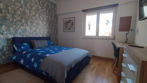 Spacious and comfortable room, with large bed, wardrobe, dresser and smart TV.