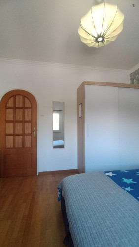 Spacious and comfortable room, with large bed, wardrobe, dresser and smart TV.