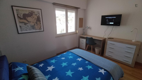 Spacious and comfortable room, with large bed, wardrobe, dresser and smart TV.