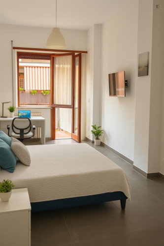 Spacious double bedroom with balcony in 5-bedroom apartment