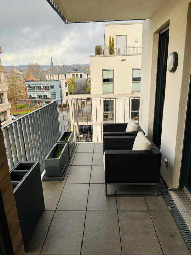 New luxury apartment in a prime downtown location, with balcony and parking space