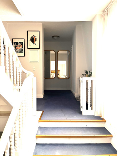 Elegant 4½-room apartment with lake view, two bathrooms, and private garden area in a historic villa