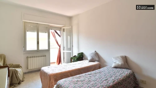 Room in a shared 4-bedroom apartment for rent in Casal Bruciato for professionals and students