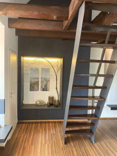 An open-plan loft flat with a mezzanine