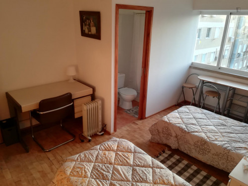 Multiple beds bedroom, with private bathroom in 8-bedroom apartment