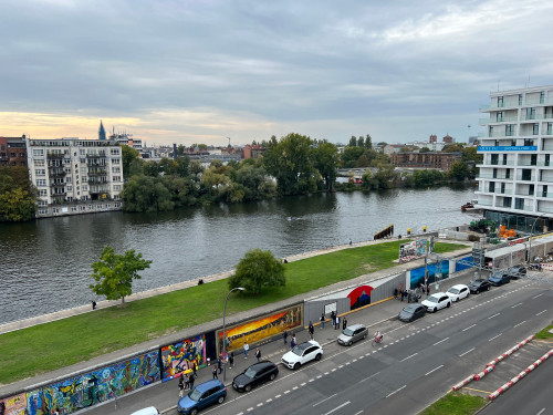 Premium modern two-room Apartment in top location with beautiful views of the River Spree, the historic Berlin Wall and the Oberbaum Bridge