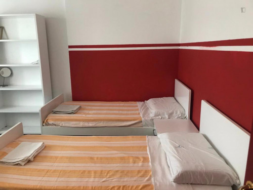 Bed in a twin bedroom close to NABA