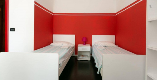 Bed in a twin bedroom close to NABA