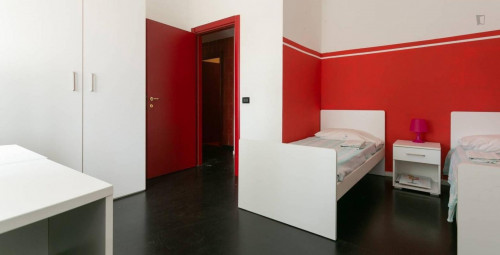 Bed in a twin bedroom close to NABA