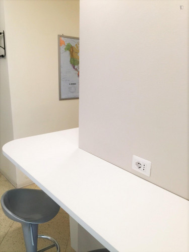 Bed in a twin bedroom close to NABA