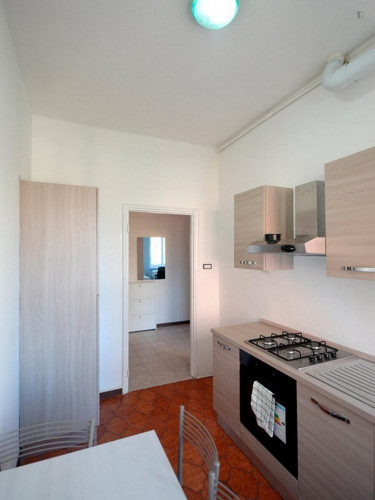 Bed in a twin bedroom close to Romolo metro station