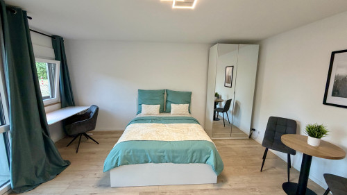 Modern studio with private terrace and view of a residents only garden