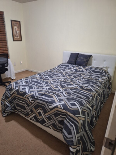 Small room with a full size bed