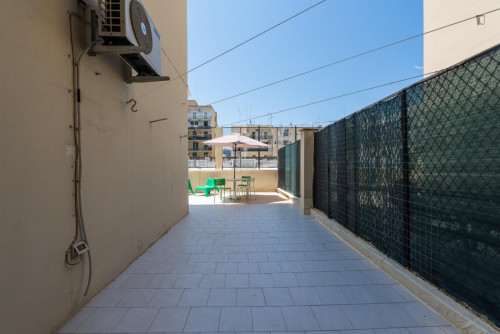 Large bedroom in a 4-bedroom apartment near Bari Sud Est train station