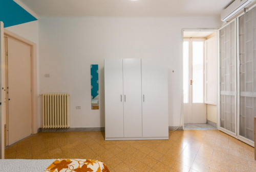 Large bedroom in a 4-bedroom apartment near Bari Sud Est train station