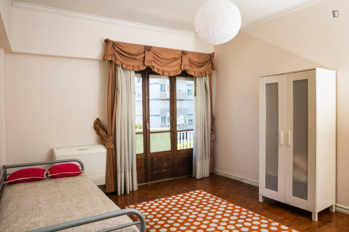 Bright spacious bedroom with a balcony near the university city and the Catholic and European universities