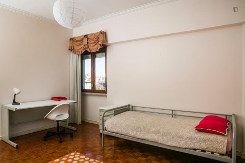 Bright spacious bedroom with a balcony near the university city and the Catholic and European universities