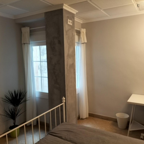 Albufereta Room - Large quiet bedroom with two patio windows.