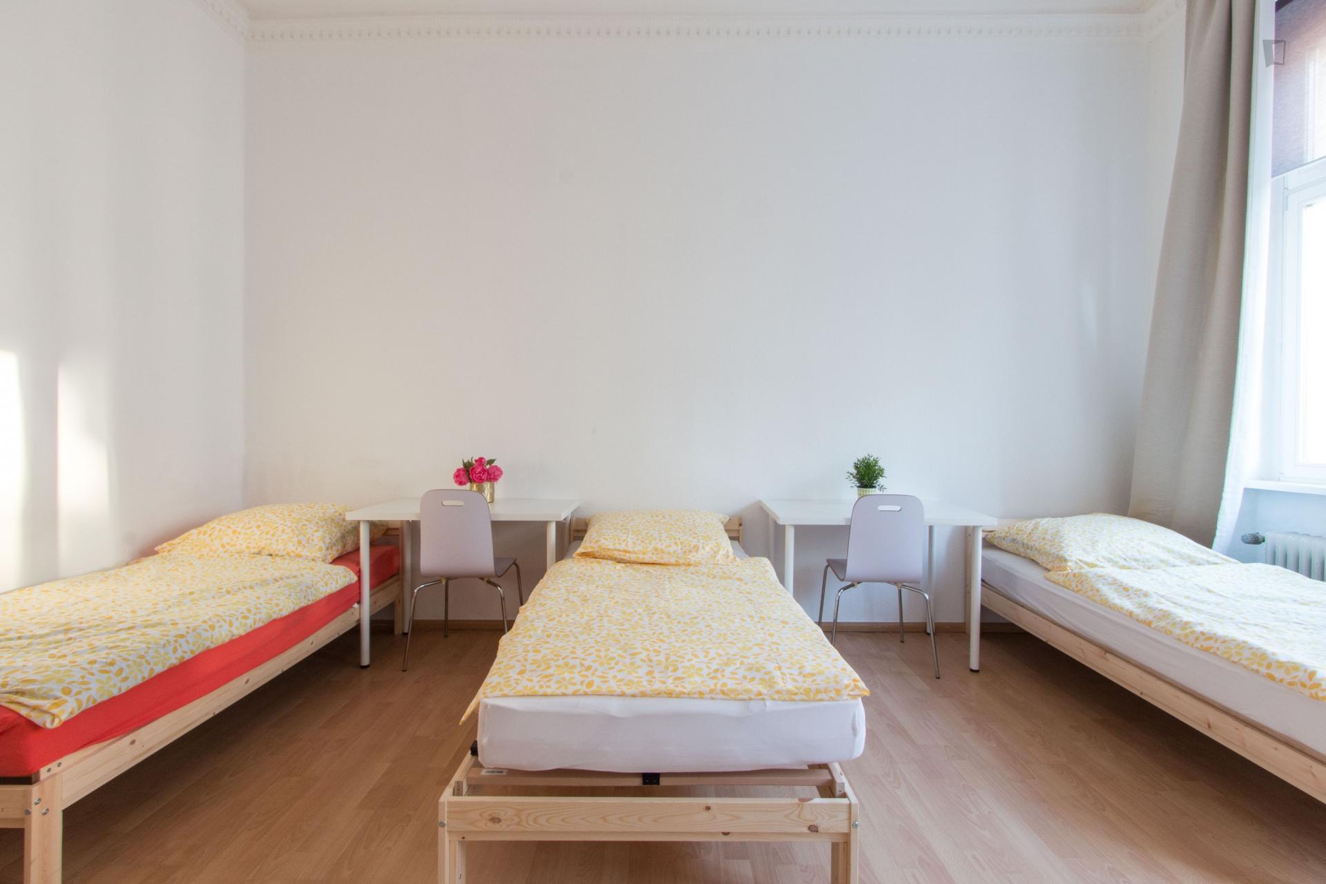 Bed in triple bedroom in Tiergarten
