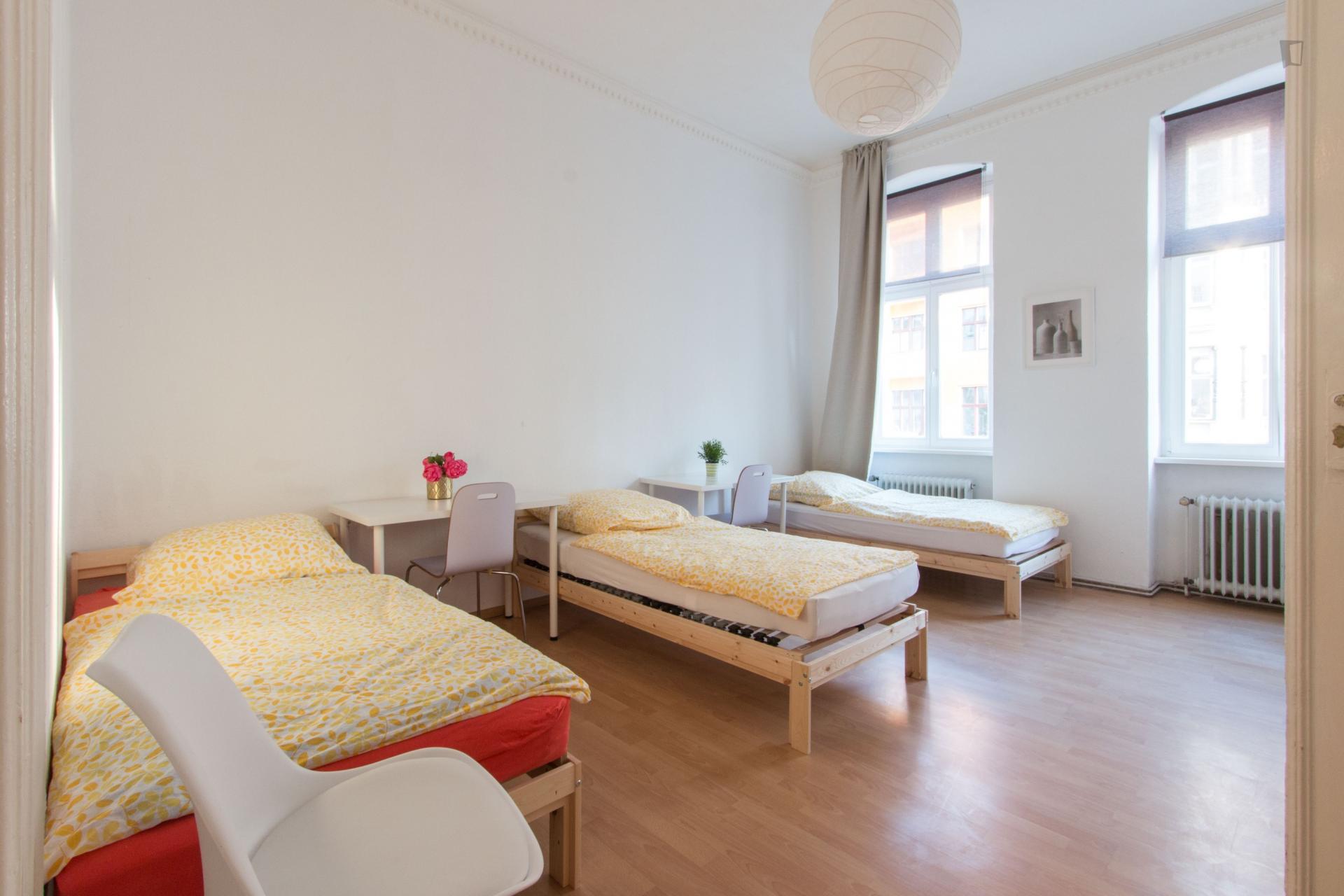 Bed in triple bedroom in Tiergarten